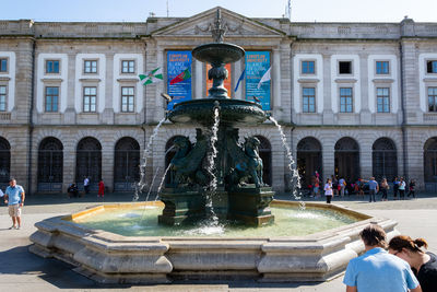Fountain in front of historic building