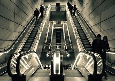 Man standing on escalator