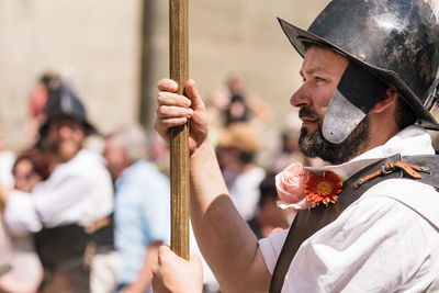 Close-up of couple holding cross