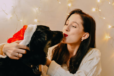 Portrait of young woman with dog