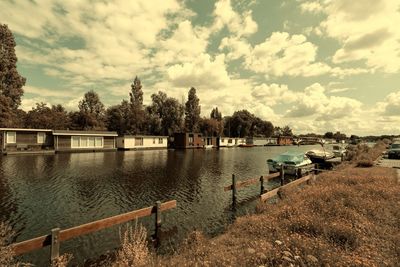 Scenic view of lake against cloudy sky