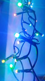 Low angle view of illuminated lamp