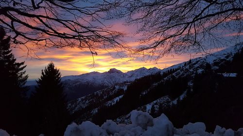 Scenic view of silhouette mountains against sky during sunset