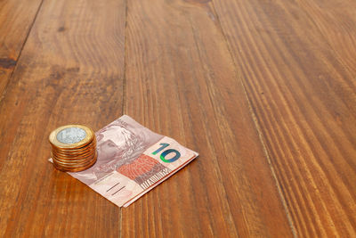 High angle view of coins on table