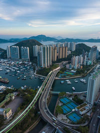 Aerial view of cityscape against sky during sunset