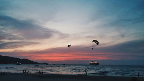 Scenic view of beach against sky during sunset