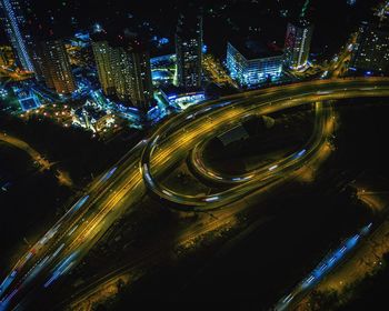 High angle view of light trails on highway at night