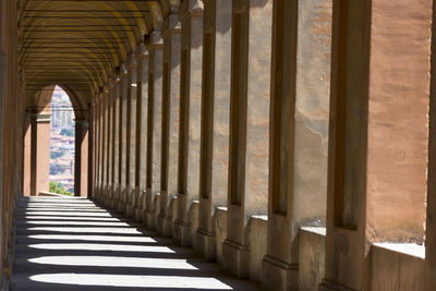 Long empty corridor along pillars