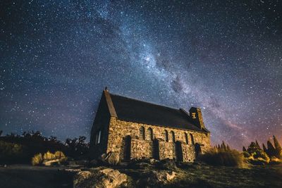 Low angle view of building against sky at night