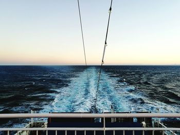 Scenic view of sea against clear sky during sunset