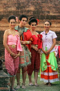 Portrait of a smiling young women standing outdoors