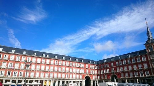 Low angle view of building against blue sky