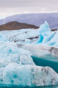 
icebergs against sky