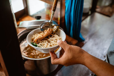 Midsection of man preparing food