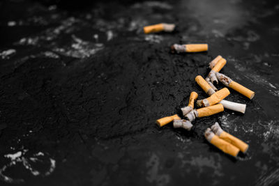 Close-up of cigarette smoking on floor