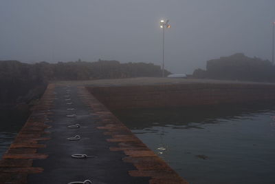 Street lights on footpath at night