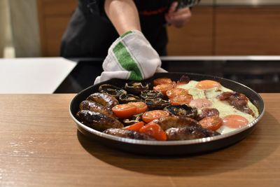 Close-up of hand preparing food in kitchen