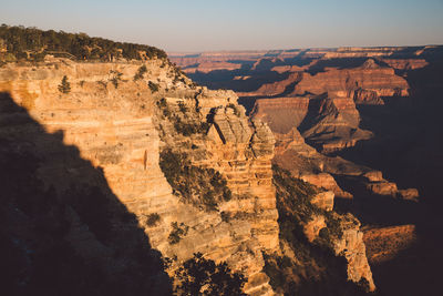 Scenic view of mountains against clear sky at grand canyon national park during sunset