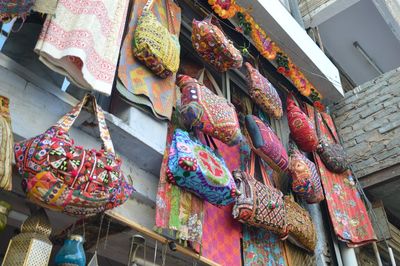 Low angle view of traditional bags hanging at market