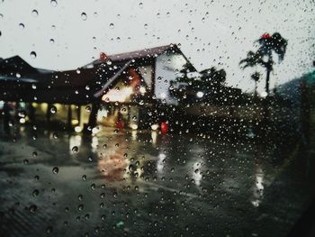 Raindrops on glass window in rainy season