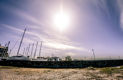 Sailboats on field against sky