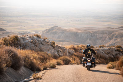 Man riding motorcycle on road