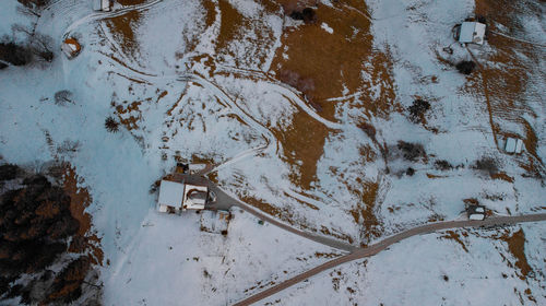 High angle view of snow on rusty metal during winter