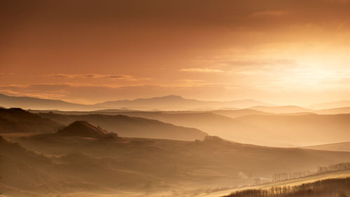 Scenic view of mountains against sky during sunset