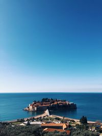 Scenic view of sea against clear blue sky