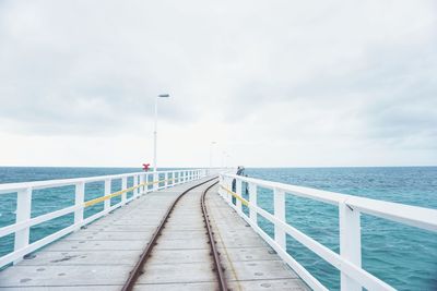 Pier over sea against sky