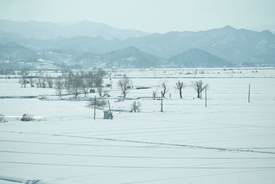 Scenic view of snow field against clear sky