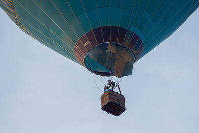 Low angle view of hot air balloon flying against sky