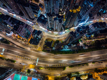 High angle view of illuminated buildings in city at night