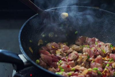 Close-up of meat in cooking pan