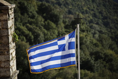 Low angle view of flag against sky