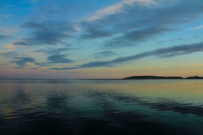 Scenic view of sea against sky at sunset