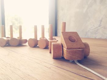 Close-up of toy vehicle on wooden table at home