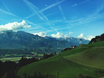 Scenic view of field against blue sky