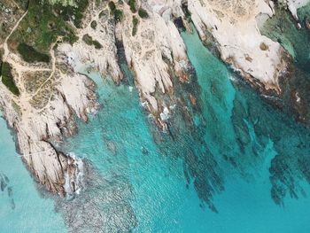 High angle view of rock formation in sea