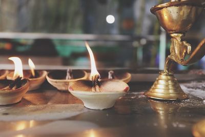 Close-up of diya on table