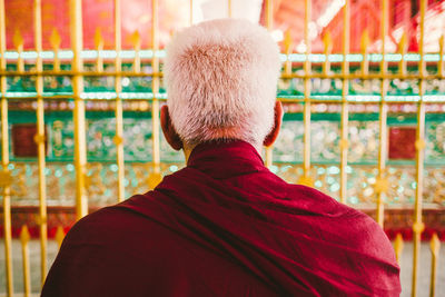 Rear view of senior buddhist monk