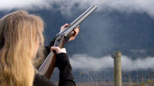 Rear view of woman against sky