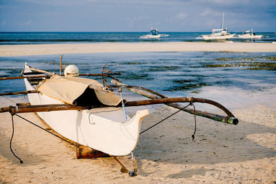 Alona beach, bohol, philippines. boat on sandy beach.