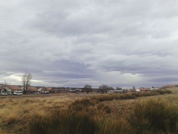 View of landscape against cloudy sky