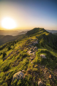 Scenic view of landscape against sky during sunset