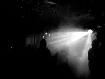 Silhouette people at music concert