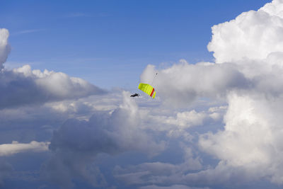 Low angle view of kite flying against sky