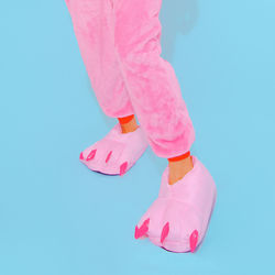 Pink pajamas party mood. funny slippers. minimal. home relax style. kigurumi shop concept