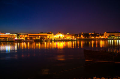 Illuminated city lit up at night