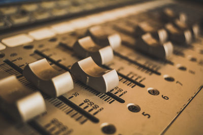 Close-up of sound mixer at studio